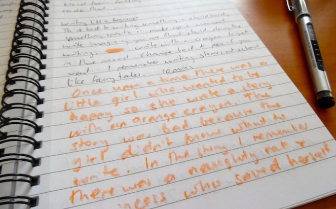 Orange crayon writing